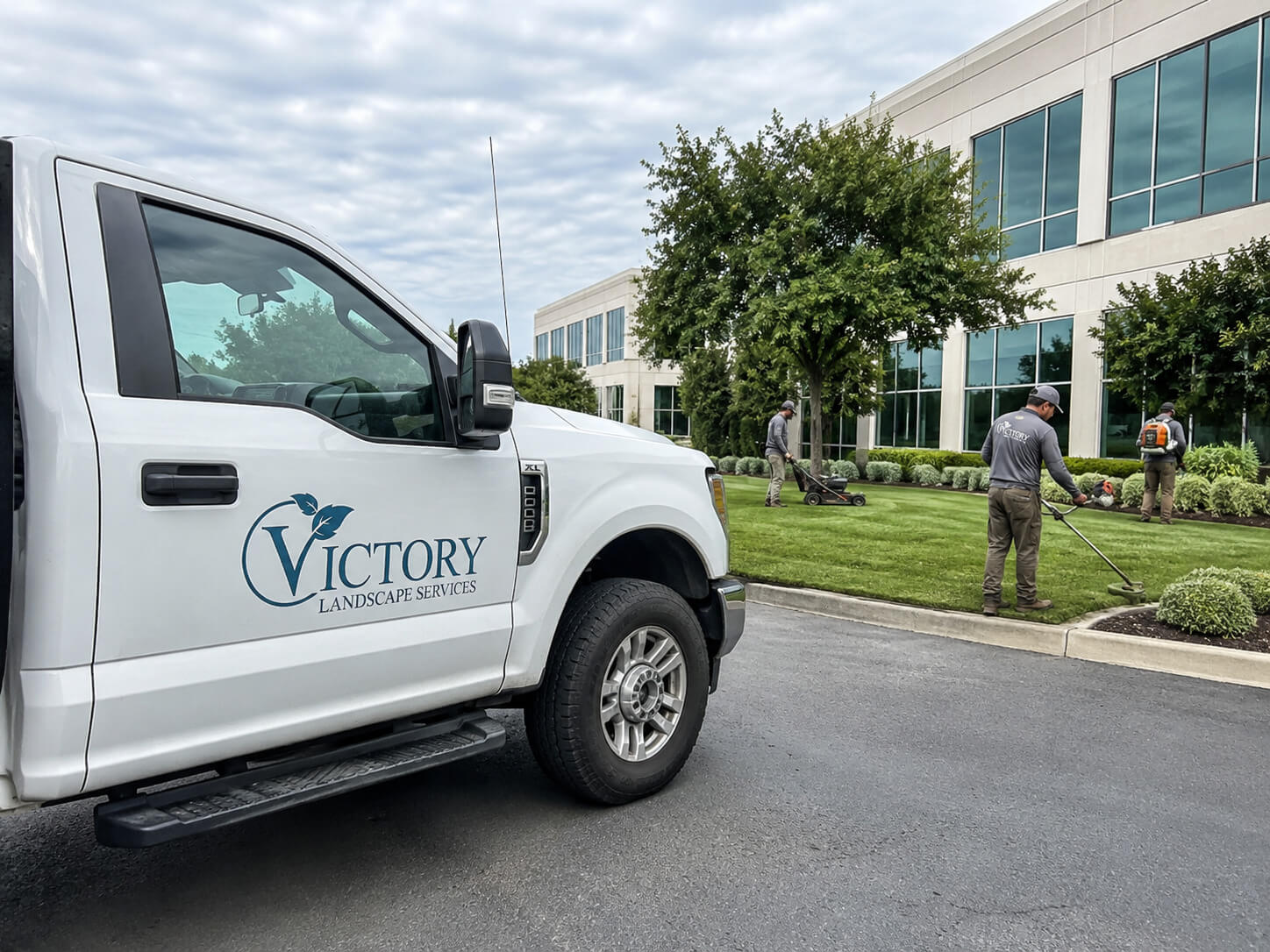 Victory Landscape Services truck parked at a managed property in the Memphis area
